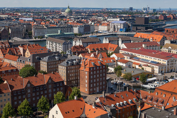 Fototapeta na wymiar Aerial view of Copenhagen red roofs and canal. Christianshavn and central distrinct
