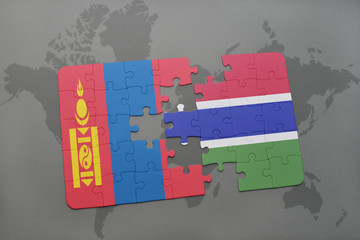 puzzle with the national flag of mongolia and gambia on a world map