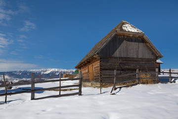 Winter in Transylvania (Romania) Old traditional countryside house in winter