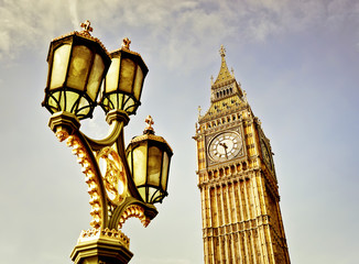 Fototapeta na wymiar Houses of Parliament with the street lamp on the Westminster Bridge in London with vintage effect.