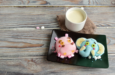 The hippopotamus, elephant are made of ice cream and coffee. A creative dessert for children and good mood.