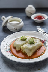 Stuffed cabbage rolls Hungarian cuisine on a white plate.
