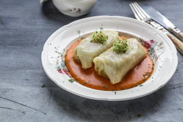 Stuffed cabbage rolls Hungarian cuisine on a white plate.