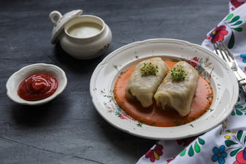 Stuffed cabbage leaves with minced meat and rice in tomato sauce.