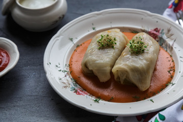 Stuffed cabbage leaves with minced meat and rice in tomato sauce.