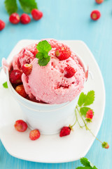 Homemade ice cream with wild strawberry.