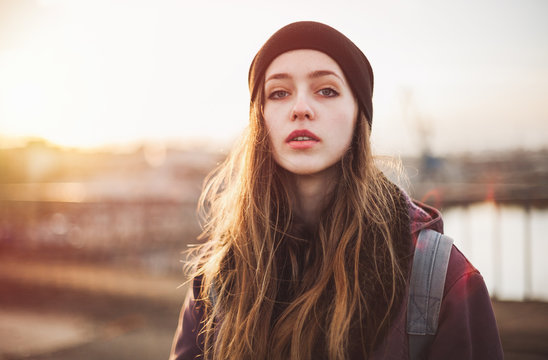Portrait of a hipster girl at sunset