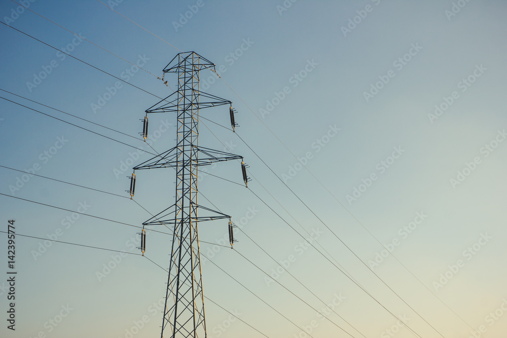 Wall mural high pylon with clear sky electricity background.