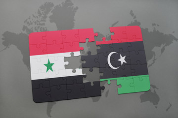 puzzle with the national flag of syria and libya on a world map