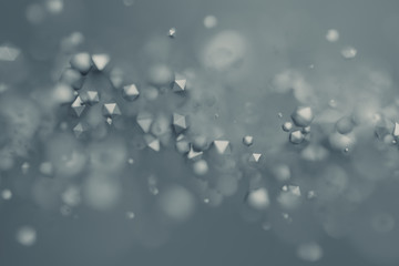 Abstract 3d rendering of chaotic low poly particles. Flying polygonal spheres in empty space. Futuristic background with bokeh effect. Poster design.