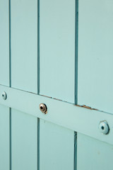 close up on French pastel green wooden window shutters
