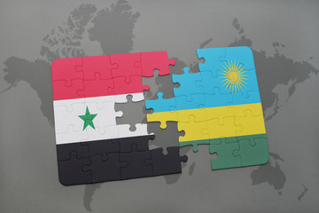 puzzle with the national flag of syria and rwanda on a world map