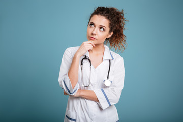 Portrait of a serious young nurse thinking and looking away