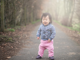 baby girl walking outdoor first time