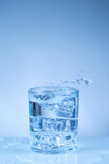ice cube into a glass of water