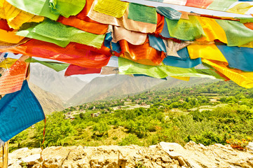 Colorful buddhist prayer flags in Sichuan - China