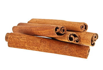 Heap of cinnamon sticks isolated on white background