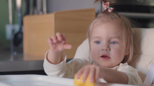 Stock image of little girl playing with construction blocks