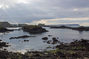 Obraz premium The rocky coastline overlooking Whitepark Bay to the north from Ballintoy harbor on the North Antrim coast in Northern Ireland