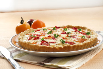 Tart with salted sheep cheese and tomatoes