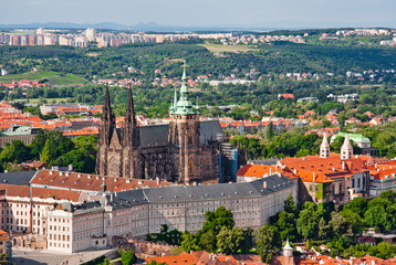 Fototapeta na wymiar Aerial view of the city. St. Vitus Cathedral over old town red roofs. Prague, Czech Republic