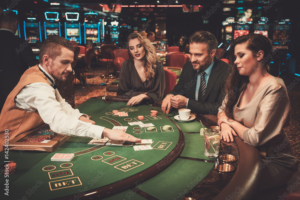 Wall mural upper class friends gambling in a casino