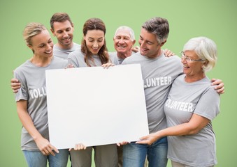 Volunteers with large blank card against green background