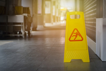 Sign showing warning of caution wet floor,selective focus,vintage color.