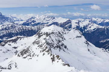Fototapeta na wymiar Landscape of Jungfrau Mountain Range in Switzerland, View of the Eiger, Monch and Jungfrau peaks from the Schilthorn (Piz Gloria), Lauterbrunnen, Bernese Alps, Switzerland, Europe, selective focus