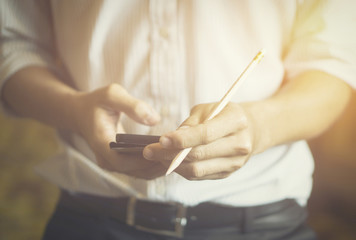 businessman working with modern devices, digital tablet computer and mobile smart phone,selective focus,vintage color