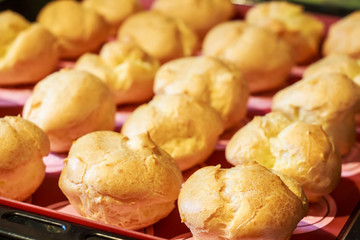 Baked profiteroles on tray