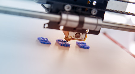 Electronic three dimensional plastic printer during work , 3D , printing.