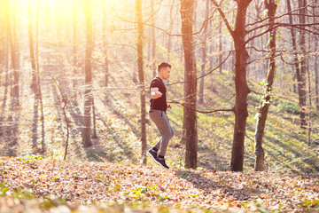 Man exercising with jump-rope outdoors