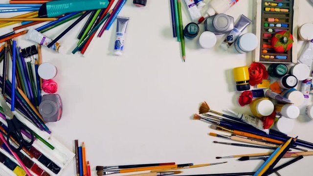 Designer, artist workspace. Hands remove objects on the table, leave blank area for you. Top view. 4K.