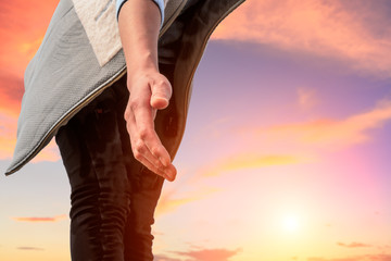 helping hand with the sky sunset background