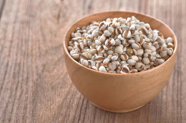 Millet in wood bowl on the table