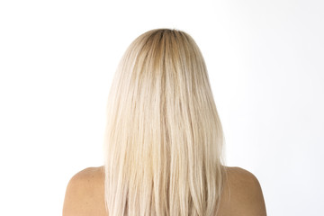 Naklejka premium Woman bare chest topless in rear view studio portrait