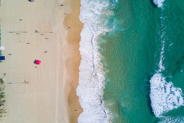 Aerial view of splashing sea waves and beach at Gold Coast.