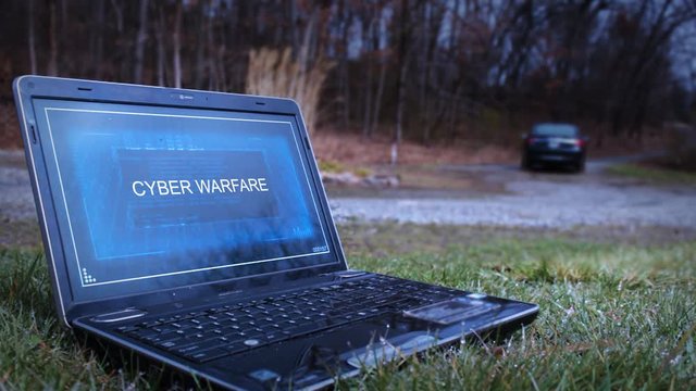Assassin flees the scene of a Laptop with Cyber Warefare interface on screen