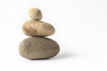 Fototapeta na wymiar Balanced zen stones pyramid over white