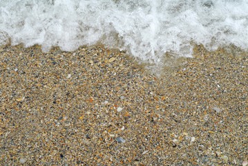 Fototapeta na wymiar sea wave on the golden beach in summer