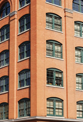 Fototapeta na wymiar close up on old brick building in downtown