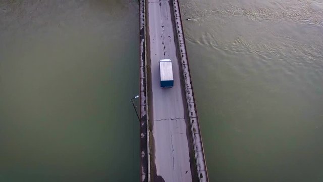 Truck car goes over the bridge