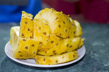 Food tropical fruit on a market pineapple on a plate
