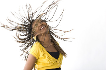 Happy African American woman's hair flying.