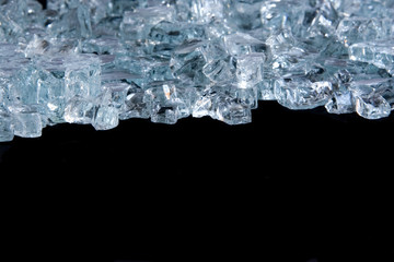 Ice cube background isolated on black with copy space.