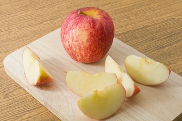 Fresh Ripe Red Apple on Wooden Tray