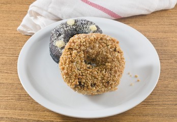 Dish of Fresh Chocolate Donut and Peanuts Donut
