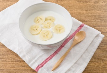 Bowl of Homemade Yoghurt with Ripe Banana