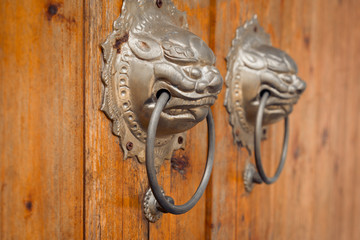 closeup of the antique oriental door knocker,Lishui city,china.